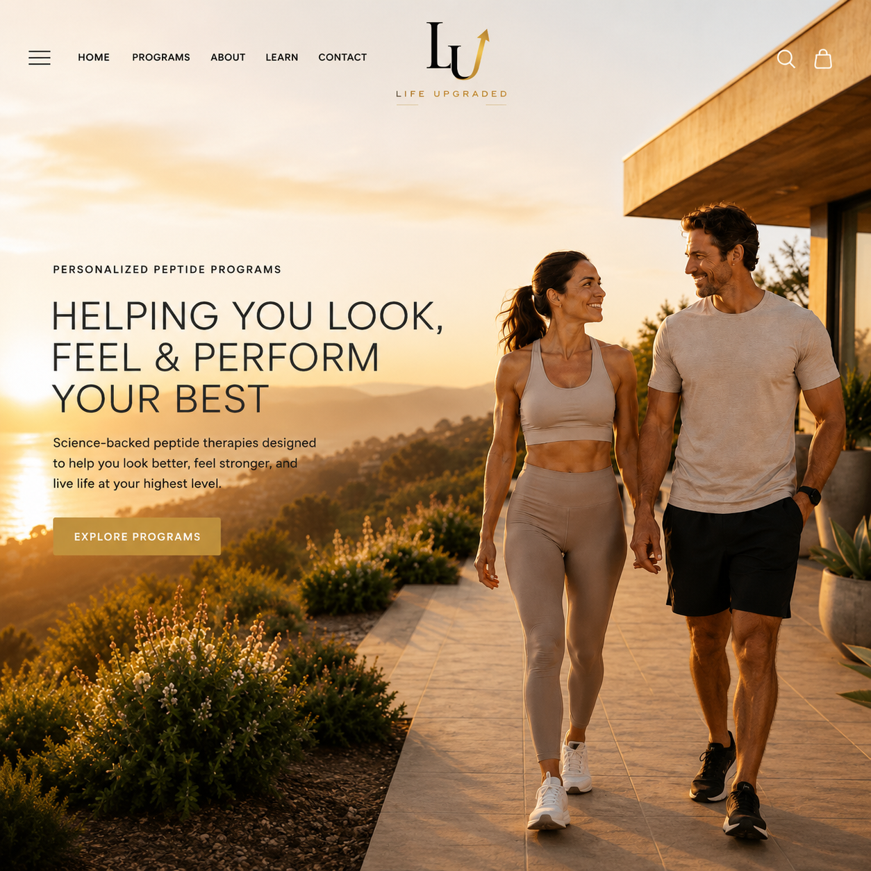 Life Upgraded homepage hero featuring a couple walking outdoors at sunset, showcasing a premium wellness website with personalized wellness programs, luxury branding, and a modern Shopify design.